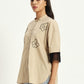 Vanilla beige shirt with floral embroidery and knitted sleeve details