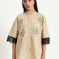 Vanilla beige shirt with floral embroidery and knitted sleeve details